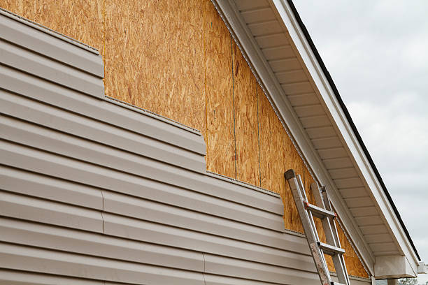 Professional Siding technician working in Geneva, NY